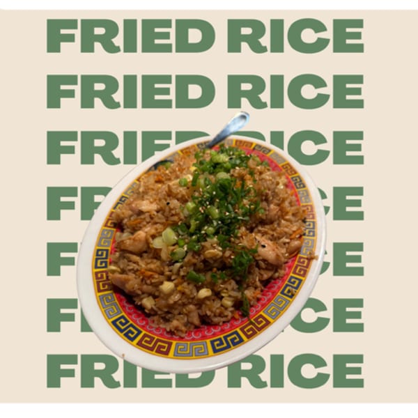 Sweetspot's fried rice with chicken, corn, and green onions on a decorative plate.